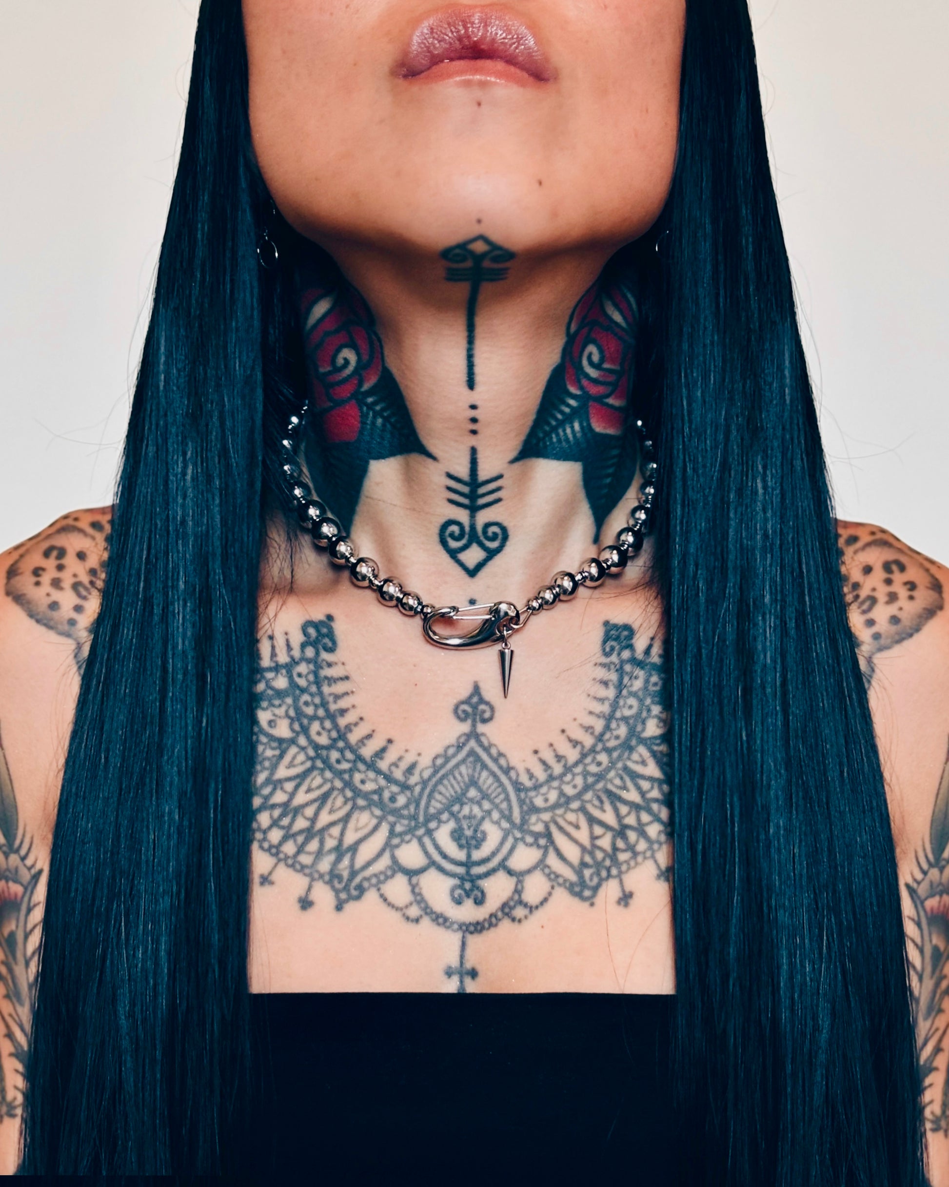 Woman wearing chrome pearl necklace